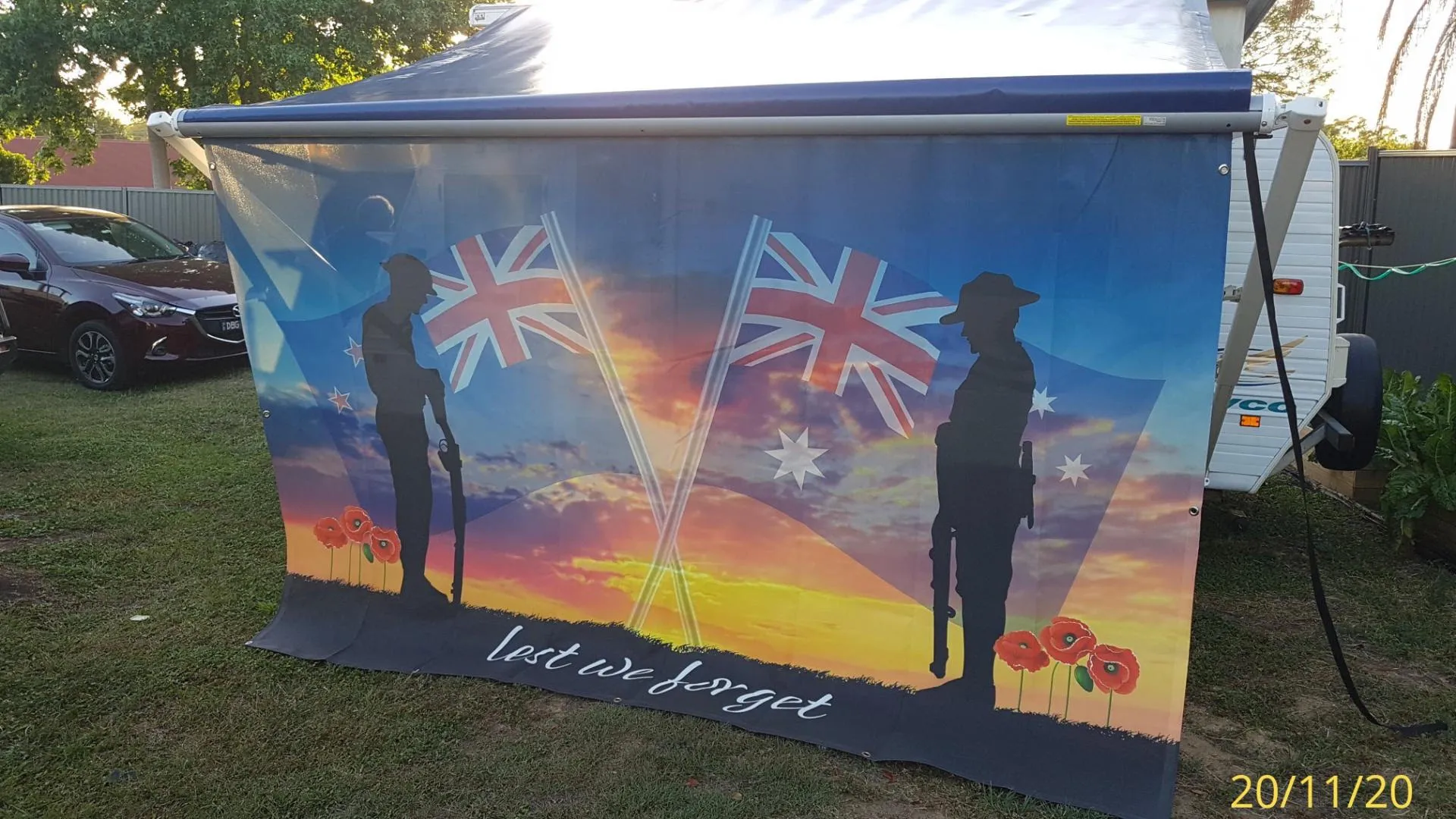 Caravan privacy screen printed with a retro Kombi van against a sunset