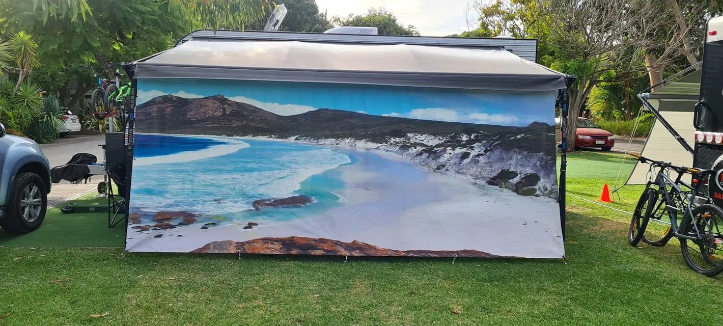 Caravan privacy screen printed with a coastal sunrise over the ocean