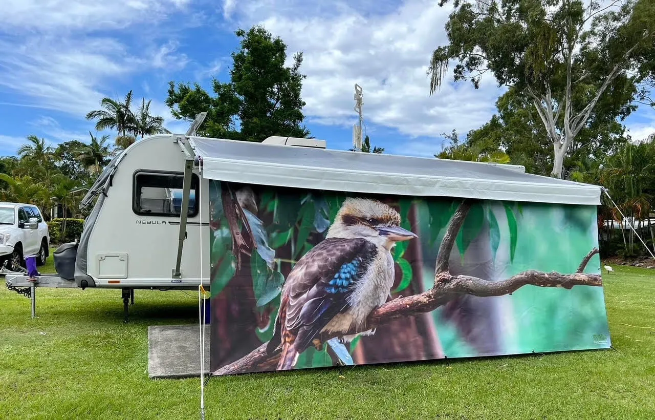 Caravan privacy screen printed with children's colourful artwork